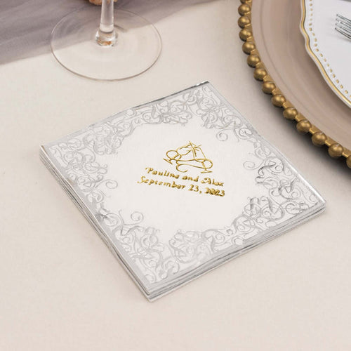 Elegant wedding invitation with gold and silver design, featuring names and date.
