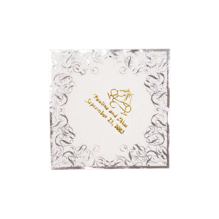 Elegant wedding invitation with gold foil and ornate silver border.