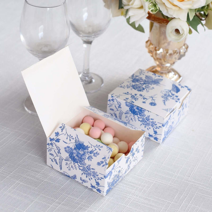 Decorative gift box with pastel candies, floral design, and open lid.
