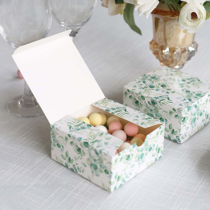 Decorative gift box with pastel-colored eggs, floral design, open lid.