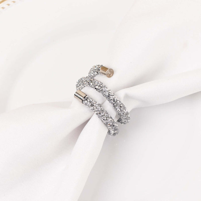 Silver napkin ring with sparkling embellishments.
