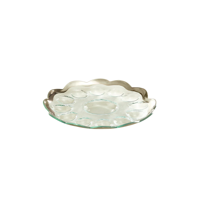 A glass devilled egg dish with a platnum rim