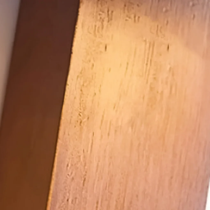 Macro texture detail of the solid wood base on Aurevo Travertine Rotatable Wall Lamp