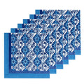 Five matching napkins with a blue and white damask floral pattern, arranged in a staggered stack