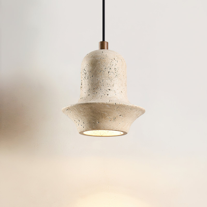 Bellora Sculpted Travertine Pendant Light - front view, lit, warm halo underglow
