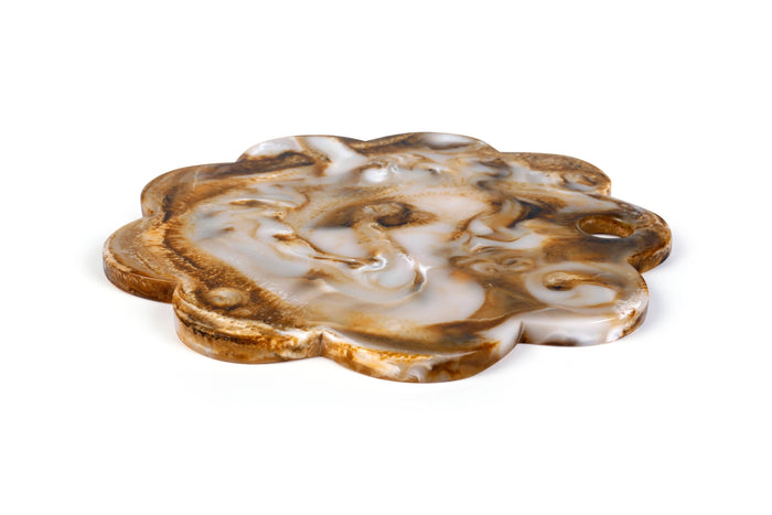 Decorative agate stone with intricate patterns on a white background
