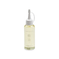 Bottle of camellia oil with white cap and Niwaki branding on white background