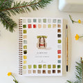 Camping watercolor workbook with color swatches