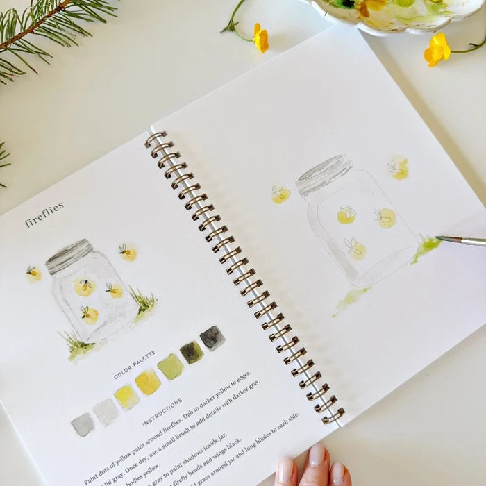 Open notebook with illustrations of firefly jars and color swatches