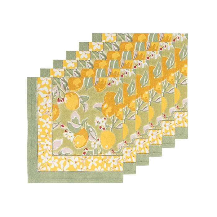 A set of six square linen napkins with a yellow and green citrus pattern, arranged in a staggered stack