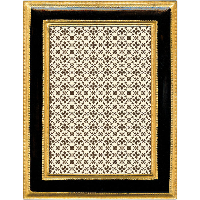 A rectangular picture frame with a glossy black outer border, a gold inner border, and a central patterned insert featuring a repeating black floral motif on a warm cream background.