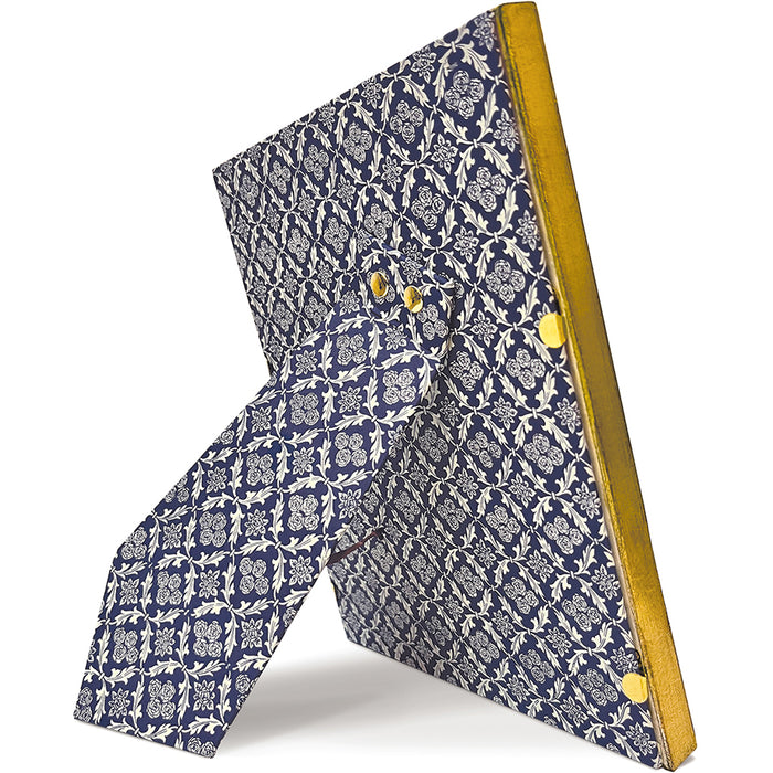 A decorative geometric sculpture or frame made from two intersecting rectangular panels with a navy blue and white floral damask pattern, finished with a metallic gold side edge and gold corner accents, shown on a white background.