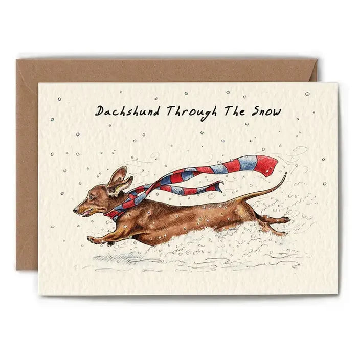 Greeting card with a dachshund illustration wearing a scarf, set against a snowy background.