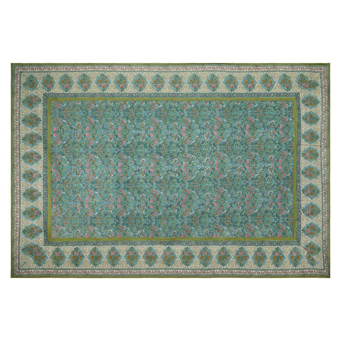 Decorative green and blue tablecloth with intricate patterns