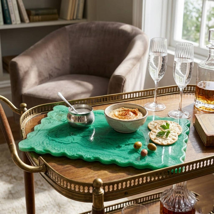 Decorative tray with food and drinks on a table in a cozy room.