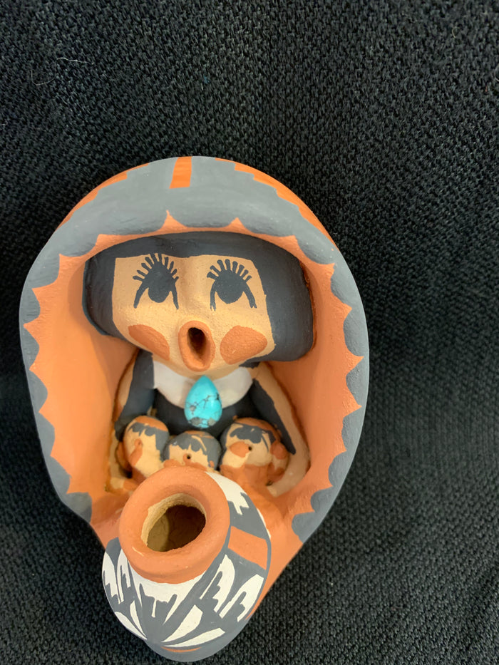 Jemez Pueblo Storyteller by artist Caroline Saul; 3 1/2” tall ; 3children