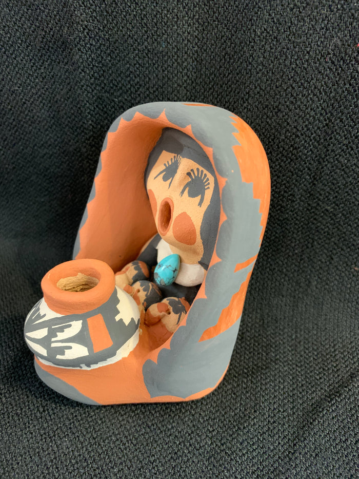 Jemez Pueblo Storyteller by artist Caroline Saul; 3 1/2” tall ; 3children