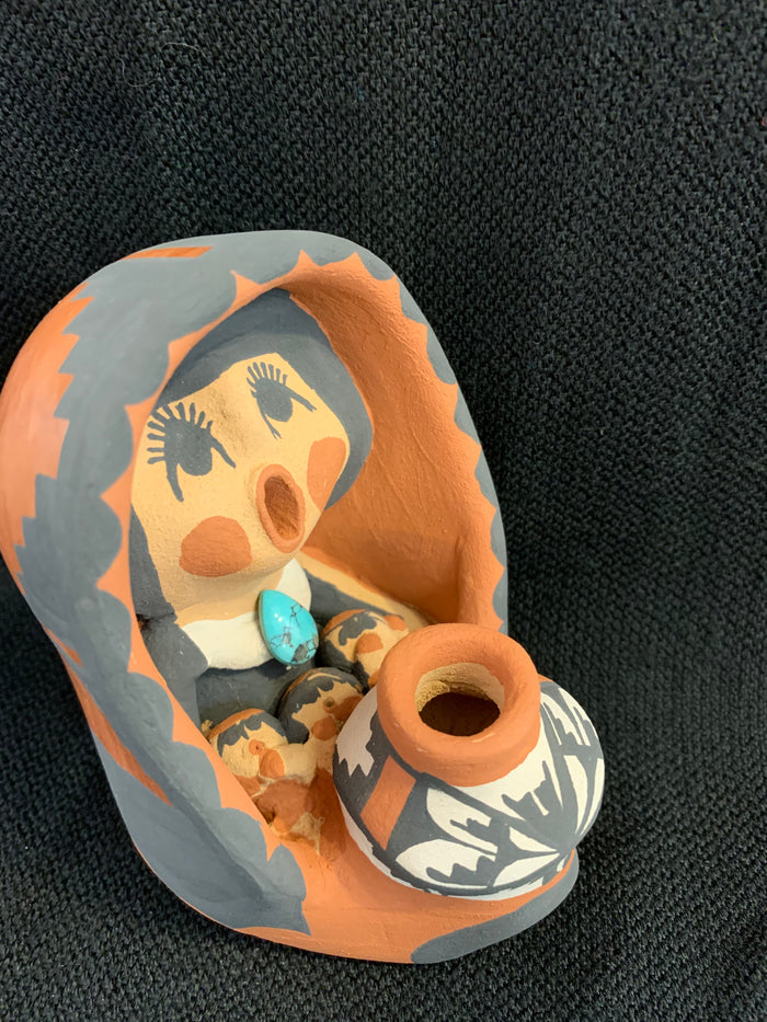 Jemez Pueblo Storyteller by artist Caroline Saul; 3 1/2” tall ; 3children