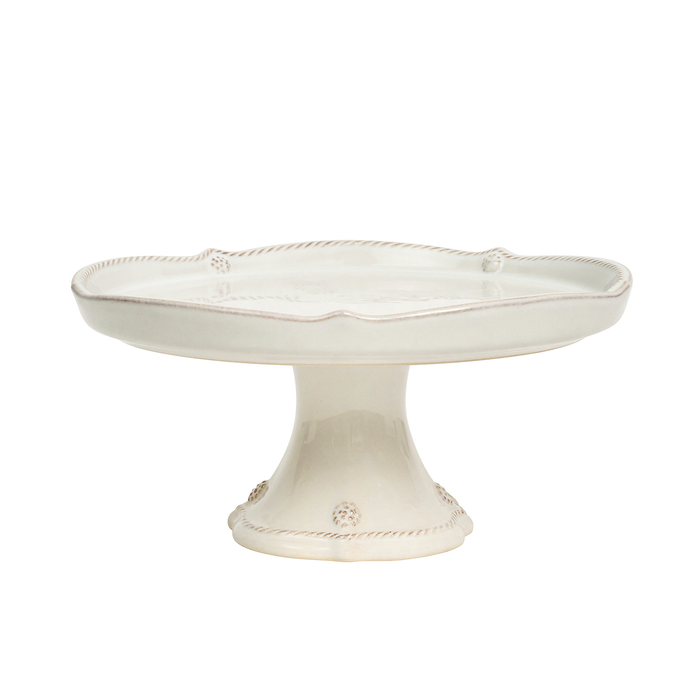 White ceramic cake stand on a white background