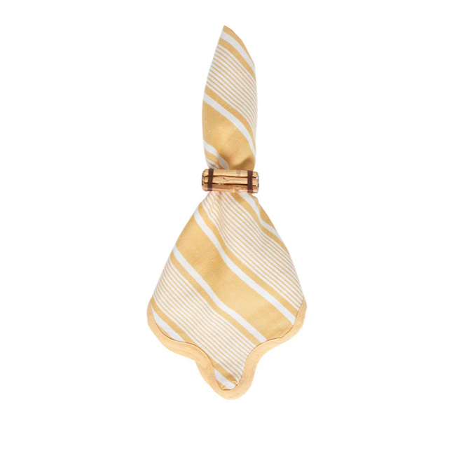 Juliska striped white and yellow napkin with a scalloped edge