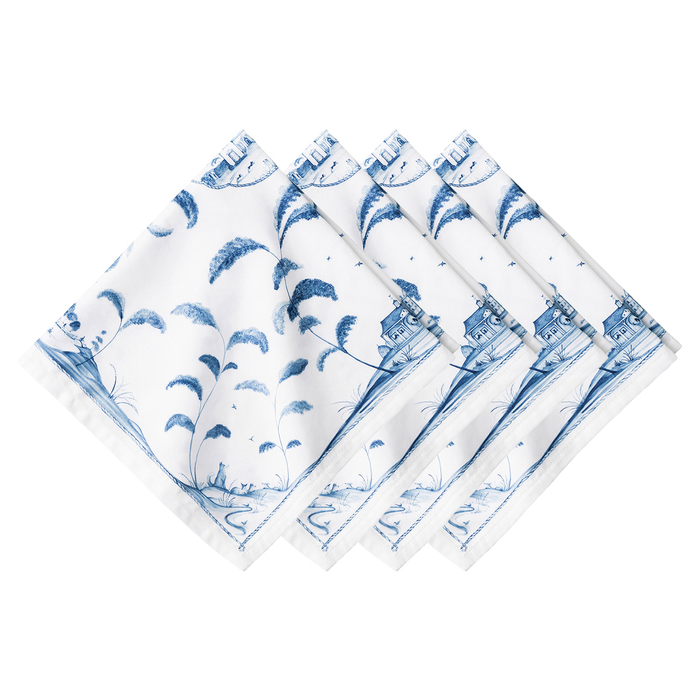 Set of four blue and white patterned napkins