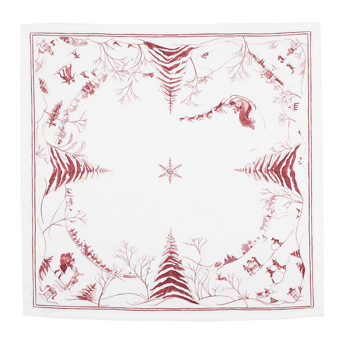 A square white napkin featuring a red winter-themed border print with pine trees, evergreen branches, deer, and a central snowflake motif.