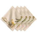 Set of four embroidered off-white napkins with nature-themed designs on a white background
