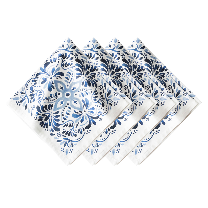 Set of four blue and white patterned napkins
