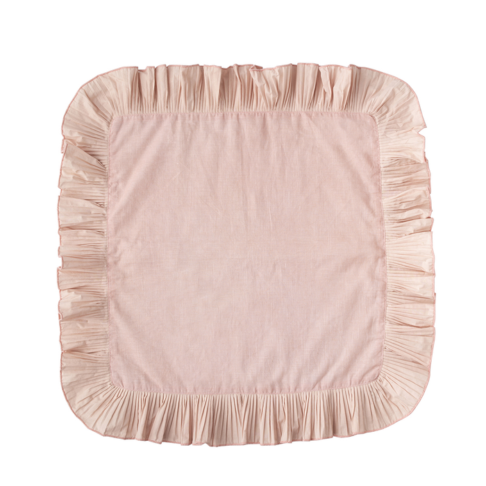 A square blush pink napkin with a ruffled border, shown flat