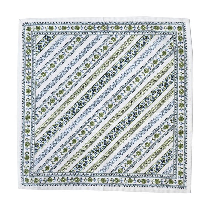 A square white napkinfeaturing a striped and floral pattern in muted blue and olive green