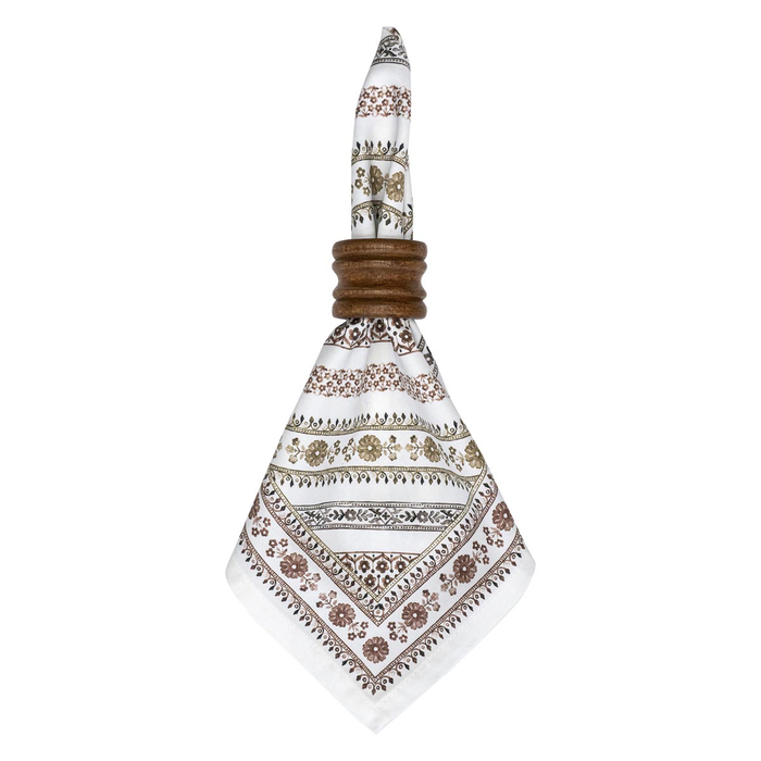 Decorative napkin ring holding a white napkin with intricate brown floral patterns