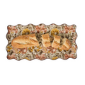 Decorative plate with floral patterns holding bread slices