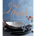 Cookbook cover titled 'Just Married' with a table setting and flowers on a blue background