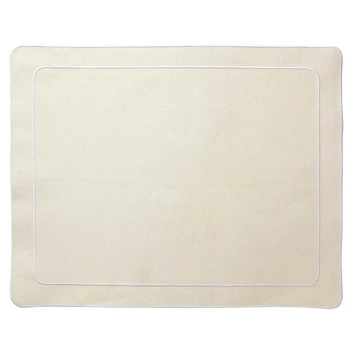 A rectangular ivory placemat with a double embroidered border.