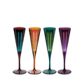 Four colorful champagne flutes on a white background