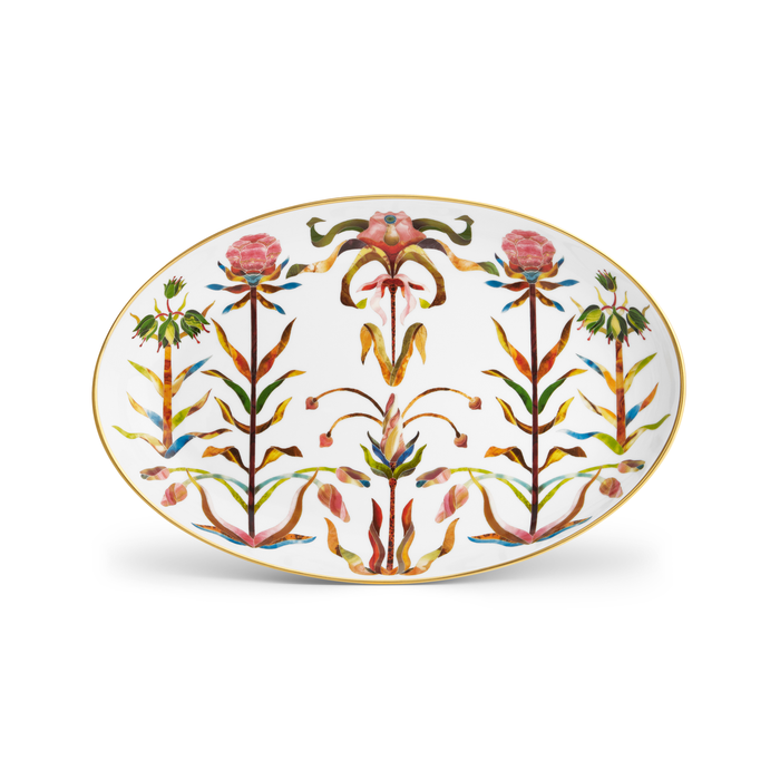 A porcelain oval platter with a painted floral pattern and a gold rim