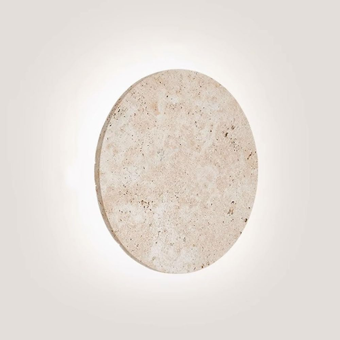 Lunaro Travertine Round Wall Sconce - front view lit with soft halo glow