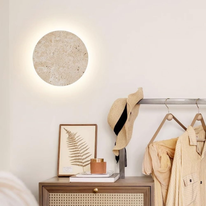Lunaro Travertine Round Wall Sconce - lifestyle above a console in an entryway