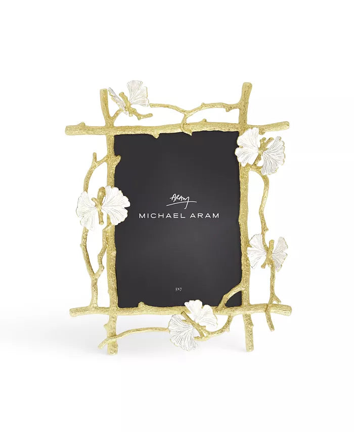 A gold and white frame with a ginkgo and butterfly theme