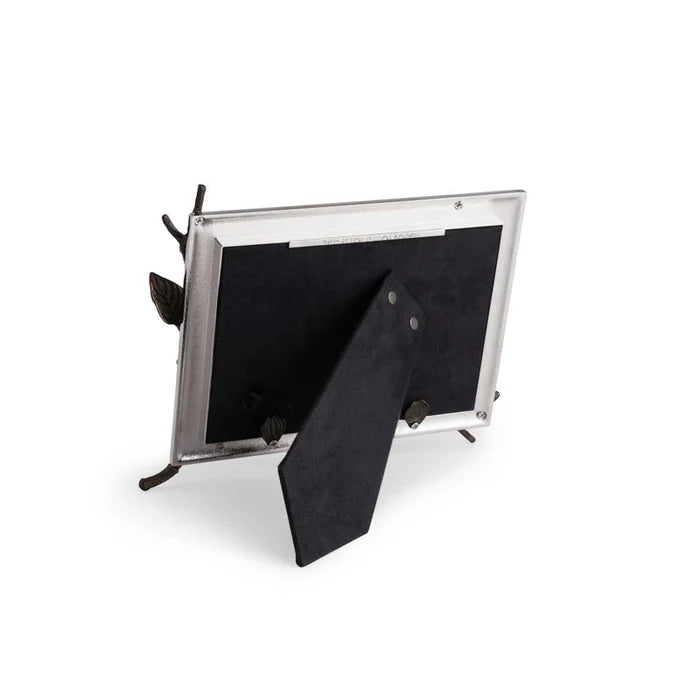 Back of a silver photo frame on a white background