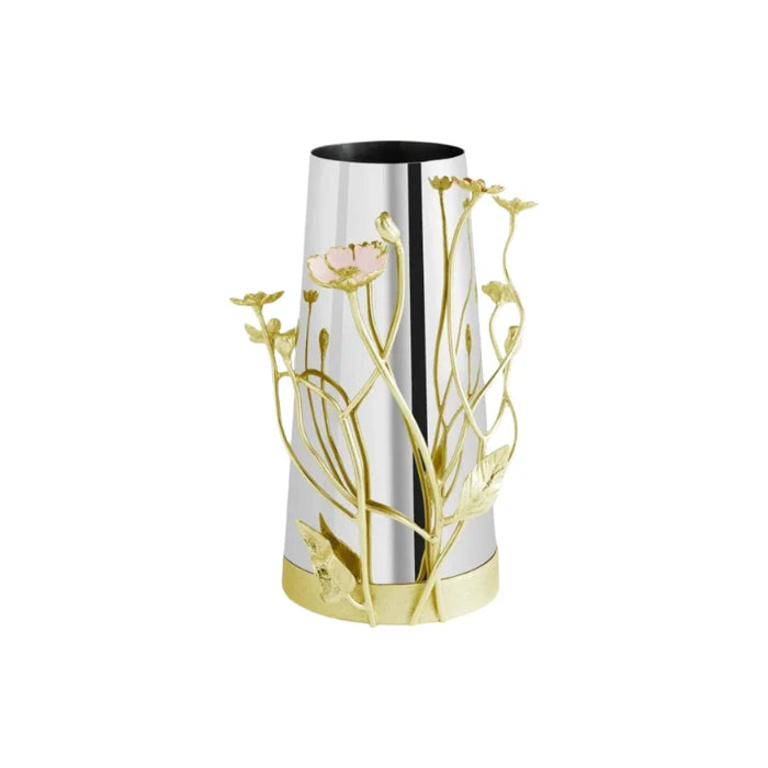 A silver and gold vase with gold  and pink wildflower sculpture climbing up