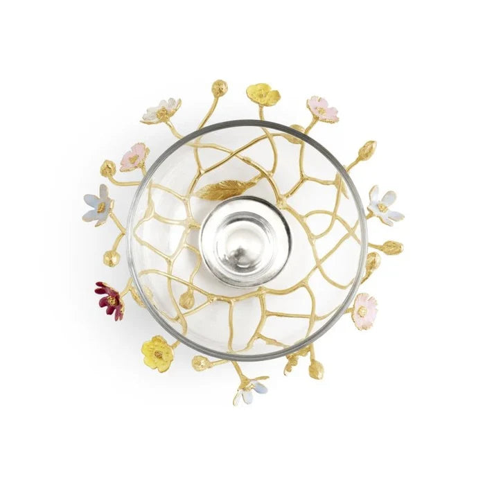 A metal gold and multicolored bowl with a glass bowl insert