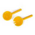 Two yellow plastic tools with handles on a white background