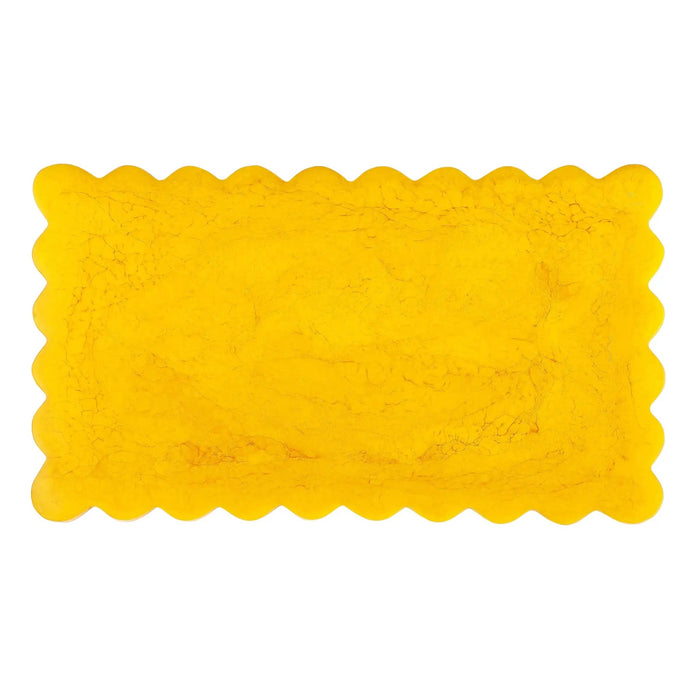 A bright yellow rectangular mat with scalloped edges, shown flat against a plain white background.