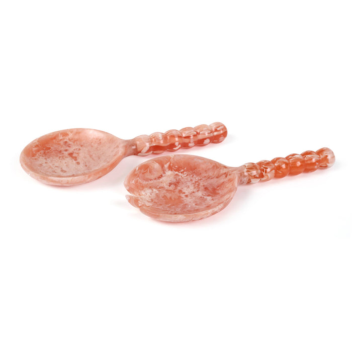 A pair of decorative serving spoons made from natural rose quartz, featuring a marbled pink and orange texture, on a clean white background.