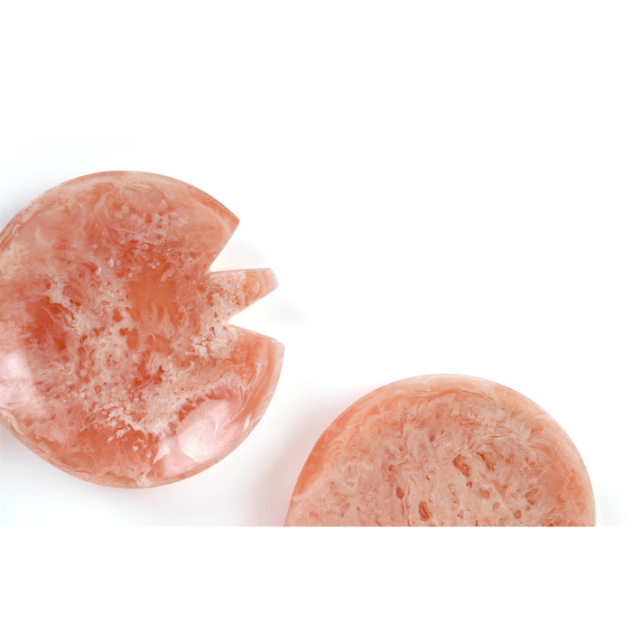 Close-up of pink stone with white interior on a white background