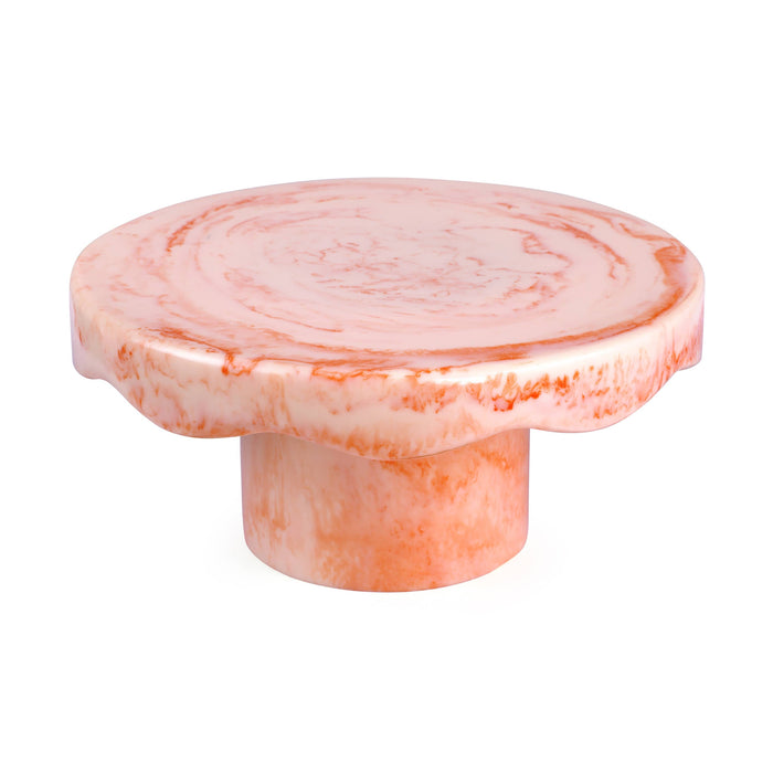 A round, scalloped-edge pedestal table made of pink and white marbled stone, shown on a plain white background.