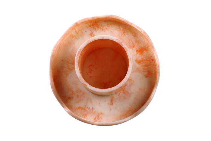 Ceramic candle holder with a marbled design on a white background