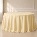 Beige seamless finish round tablecloth for elegant dining settings.