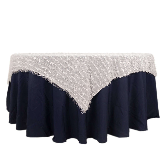 White lace tablecloth on a navy blue table cover